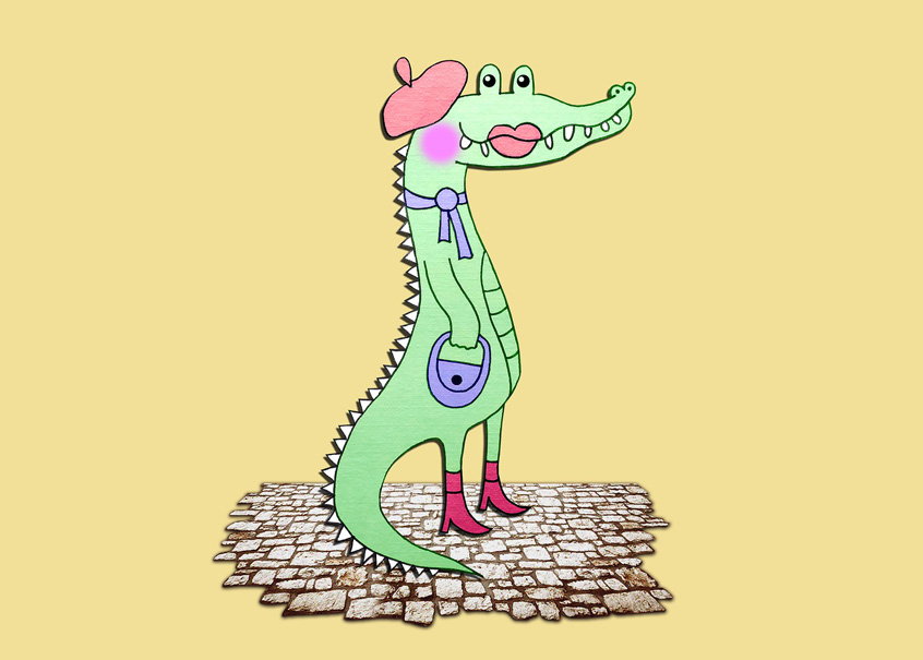 Auf einem zartgelben Hintergrund steht ein gezeichnetes hellgrünes Krokodil in Profilansicht auf den Hinterbeinen. Es trägt rote Stiefeletten an den Füßen, ein hellblaues Handtäschchen am Arm und eine hellblaue Schleife um den Hals, sowie eine rosa Baskenmütze auf dem Kopf. Geschminkt ist es mit einem rosa Bäckchen und auf dem Maul aufgemalten Lippen.